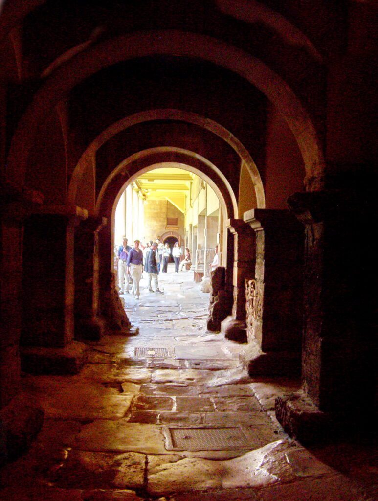 image of an arched hallway over Roman pavements, roman baths, bath, England