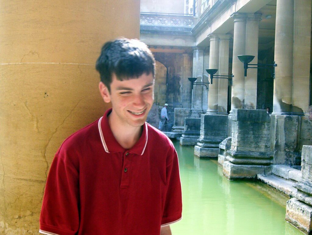 image of our son at the great bath, roman baths, bath, England