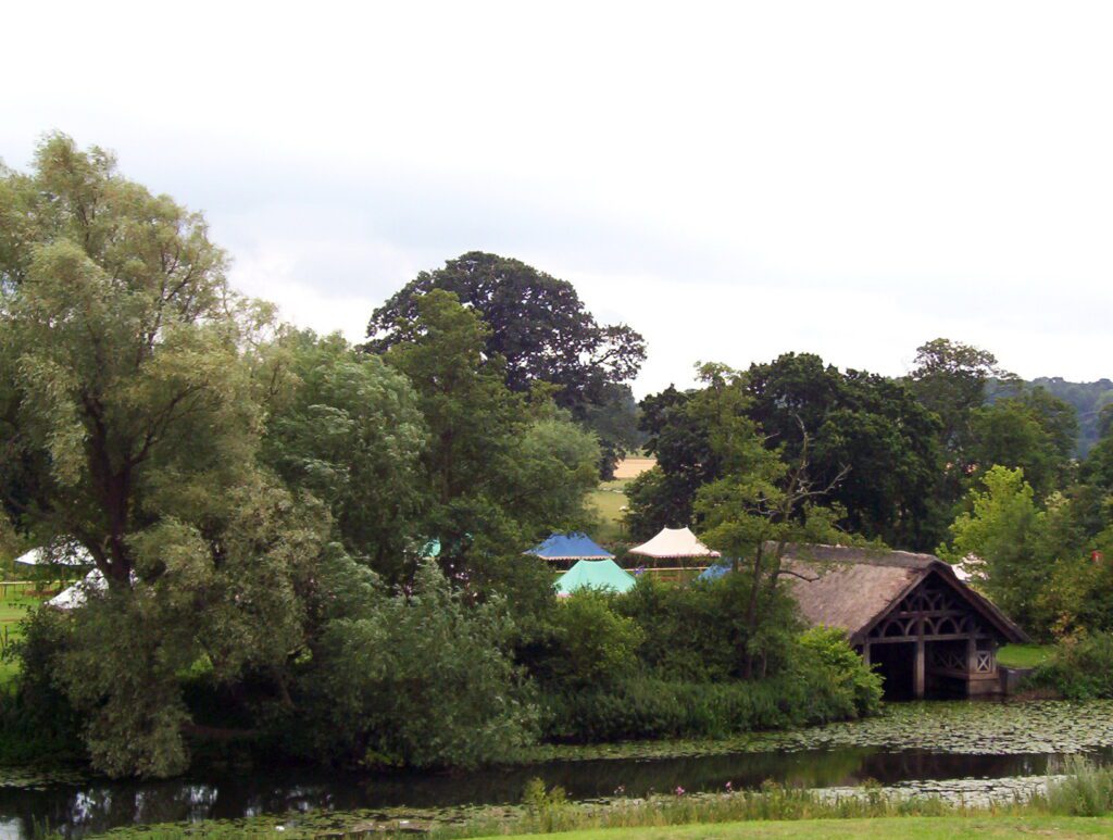 image of colourful tents on pageant field, warwick castle, england