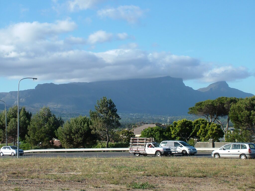 image of clouds sitting on top of table mountain, south africa