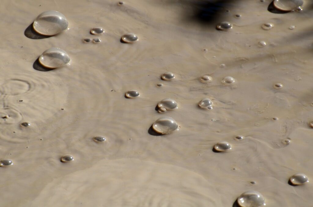 image of bubbles in a mud pool, las hornillas volcanic activity centre, miravalles volcano, costa rica 