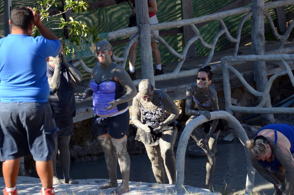 image of people covered in mud, las hornillas volcanic activity centre, miravalles volcano, costa rica 