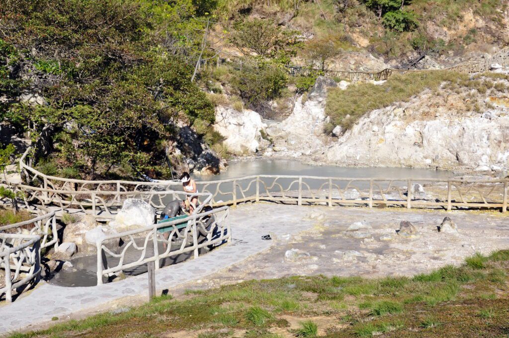 image of a person in a mud bath, las hornillas volcanic activity centre, miravalles volcano, costa rica 