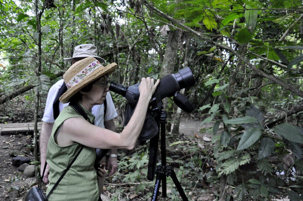 image of jean using a scope, bogarin trail, la fortuna, costa rica