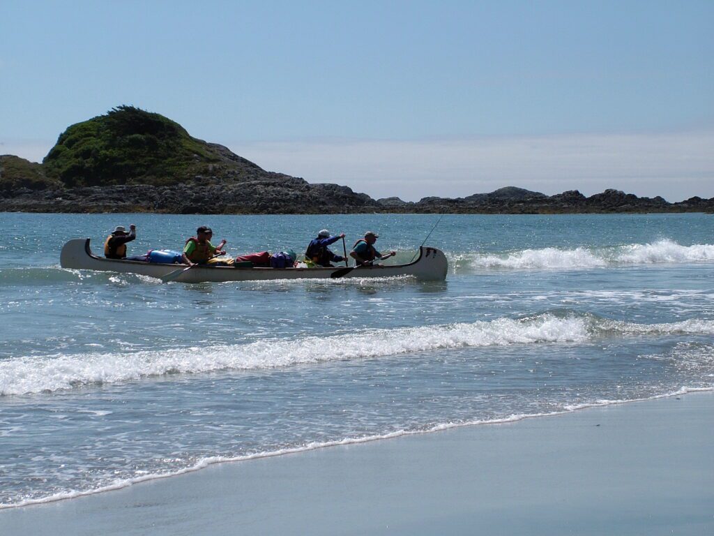 image of a war canoe, medallion beach, vargas island, british columbia