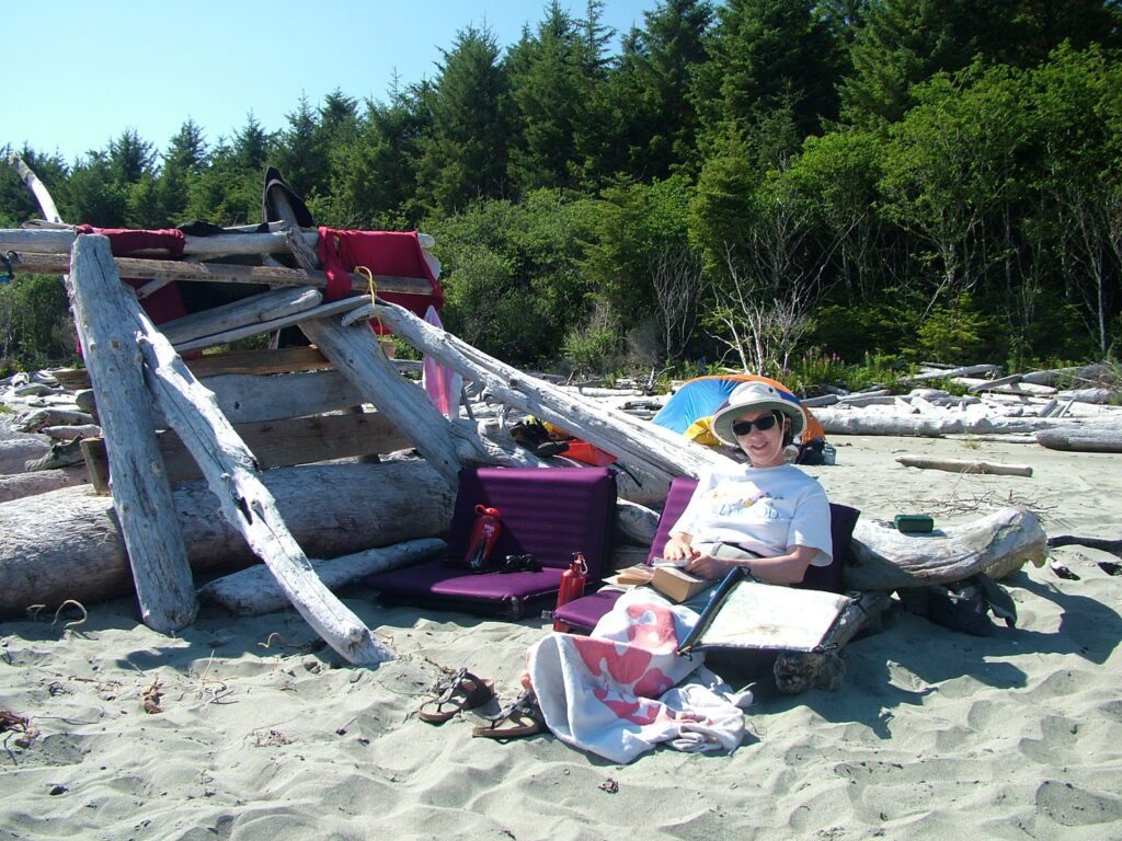 image of jean next to a lean-to on medallion beach, vargas island, british columbia