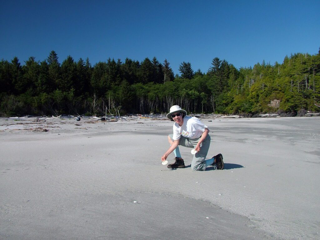 image of jean beach combing on medallion beach, vargas island, british columbia