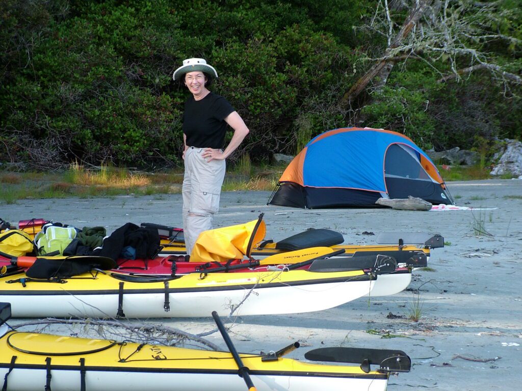 image of jean with kayaks and tent, vargas island, british columbia