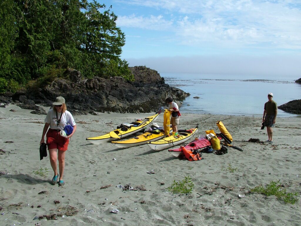 image of people and kayaks, ahous bay, vargas island, british columbia