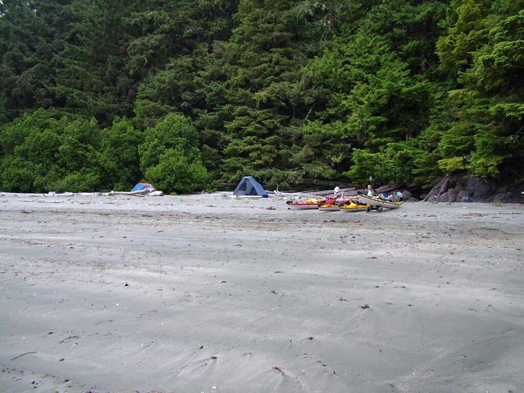 image of tents on a sand beach, ahous bay, vargas island, british columbia