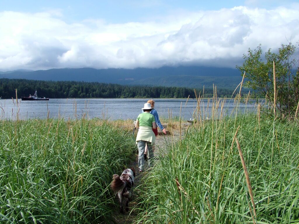 image of jean walking a dog, deep bay, vancouver island, british columbia