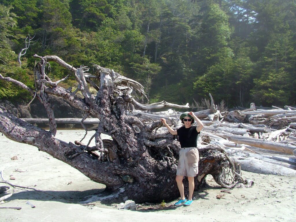 image of jean and a huge tree root, vargas island, british columbia