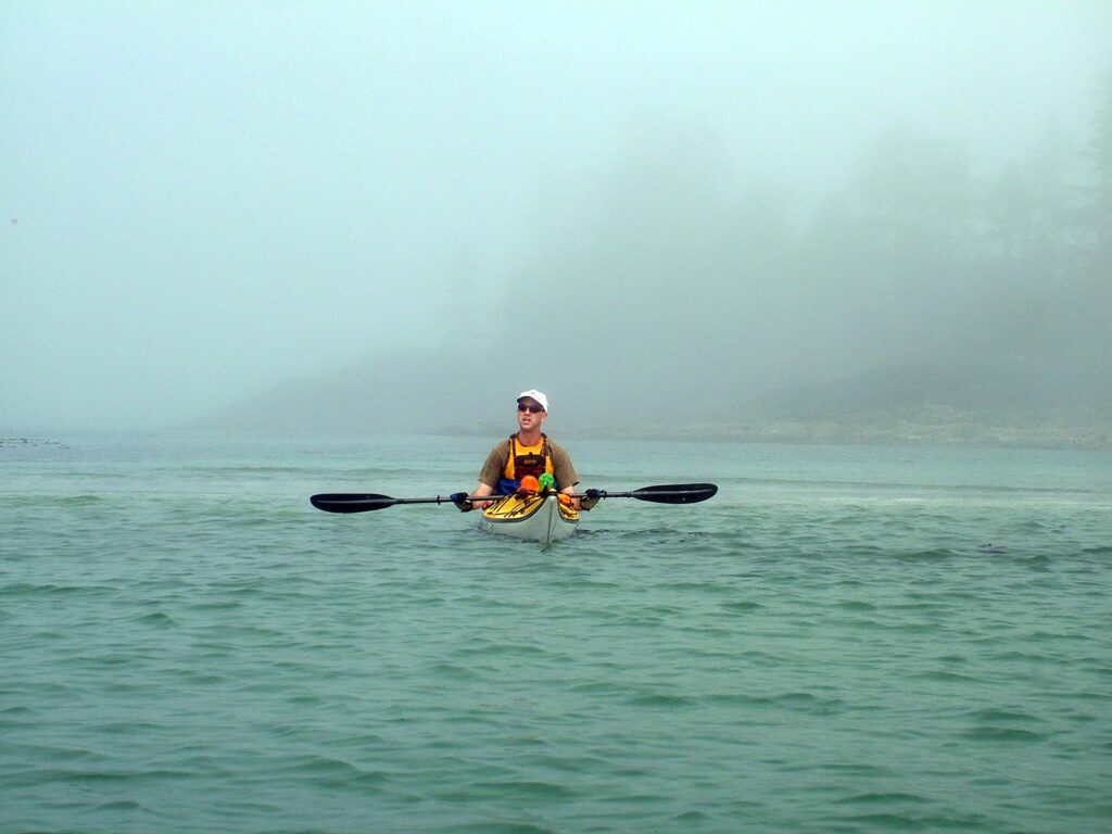 image of a kayaker in fog, vargas island, british columbia