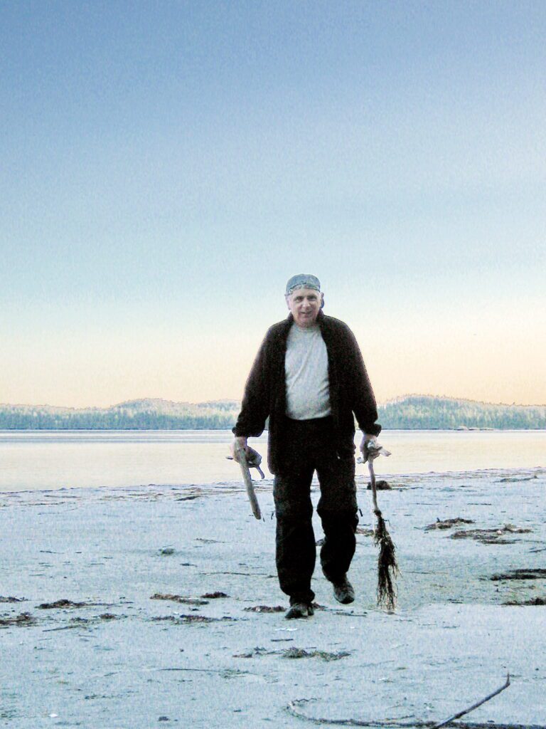 image of bob gathering firewood, vargas island, british columbia