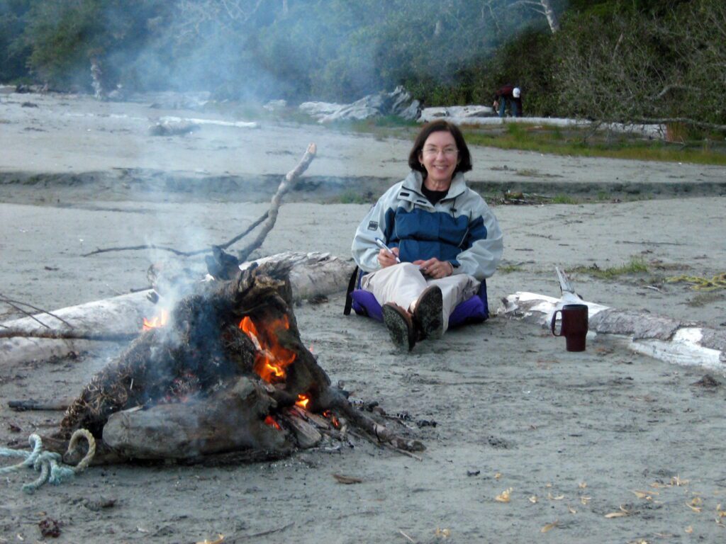 image of jean by a bonfire, vargas island, british columbia