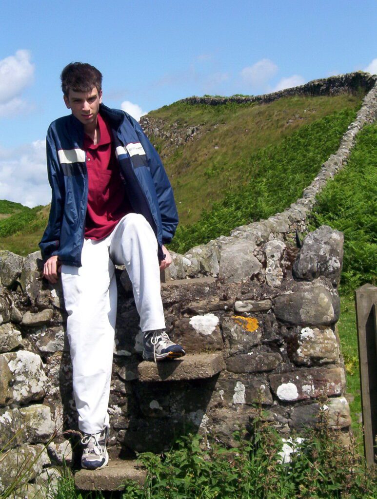 image of a person using a stile on Hadrian's Wall, England