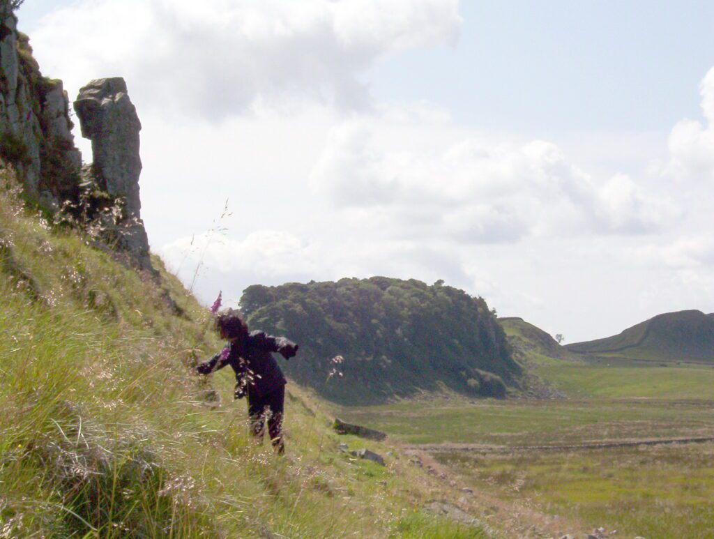 image of a person walking below the Crags, Hadrian's Wall, England