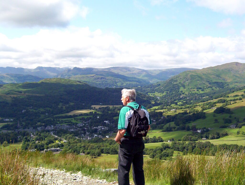 image of bob at Wansfell Pike looking towards loughrigg fell beyond Ambleside, Lake District National Park, England
