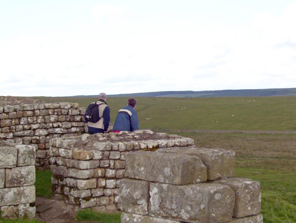 image of bob and our son, Housesteads Roman Fort, England