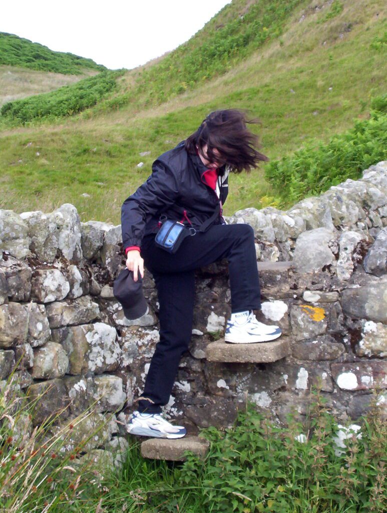 image of Jean using a stile, Hadrian's Wall, England