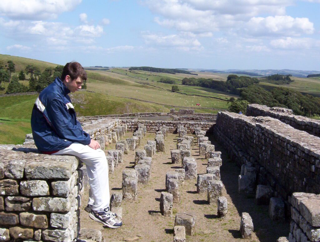 image of a person sitting in the granary, Housesteads Roman Fort, Hadrian's Wall, England