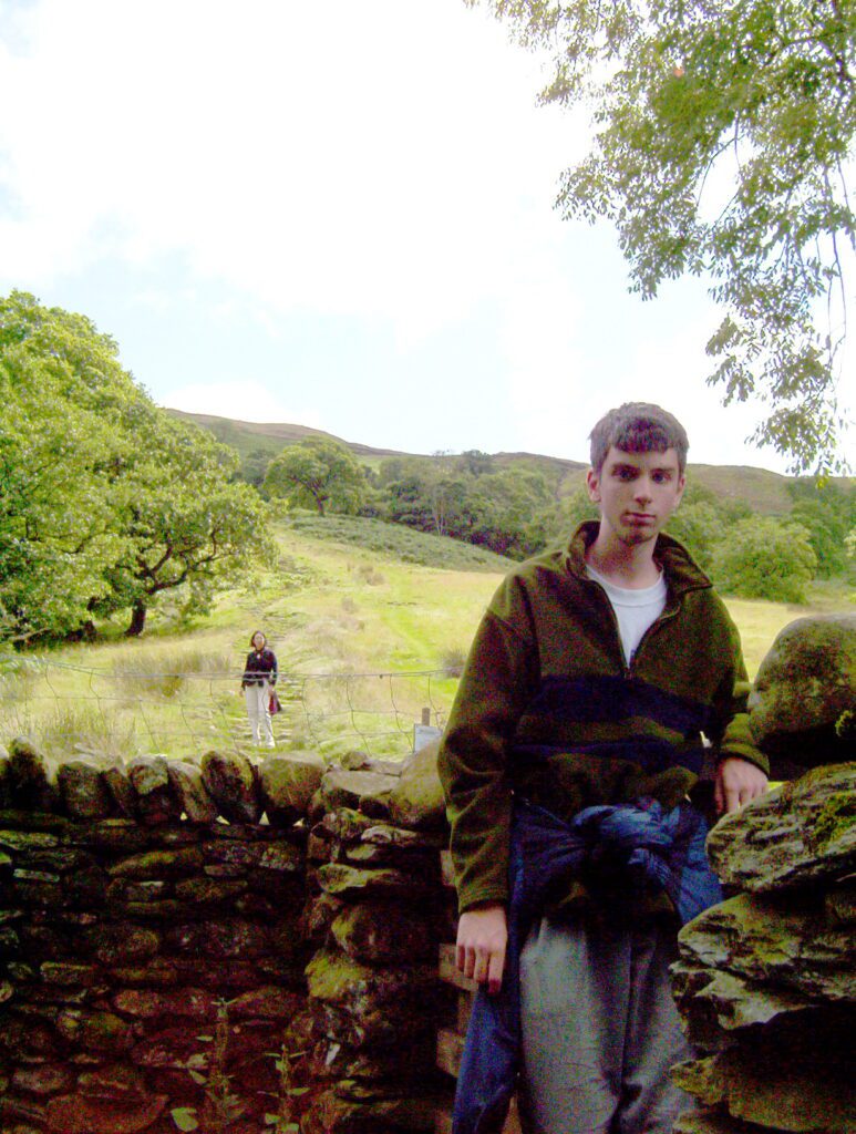 image of people hiking up Wansfell Pike, Lake District National Park, Ambleside, Cumbria, England