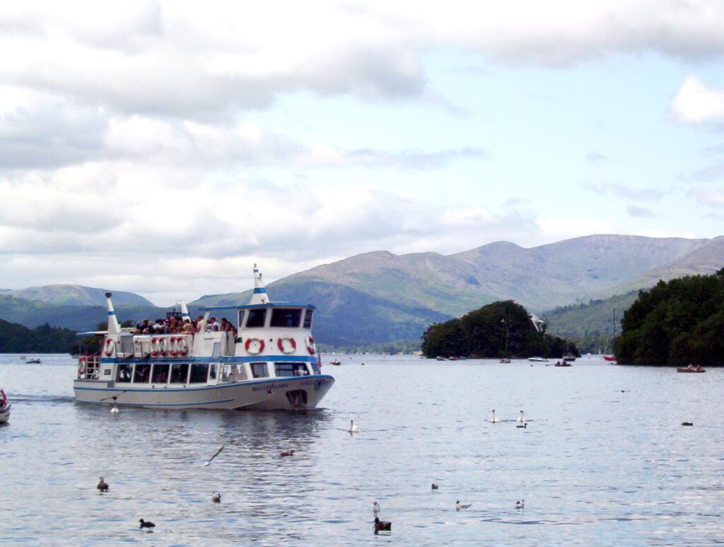 image of tour boat Miss Lakeland returning to shore, Bowness-on-Windermere, Lake District National Park, England