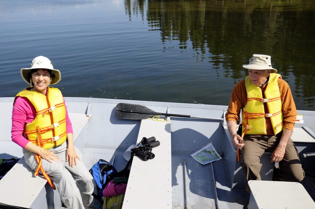 image of Jean and Bob in a motorboat, Hanging Heart Lakes, Prince Albert National Park, Saskatchewan