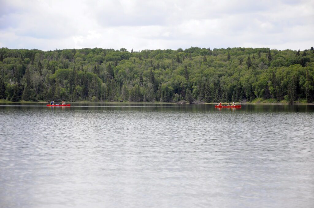 image of red canoes, Hanging Heart Lakes, Prince Albert National Park, Saskatchewan