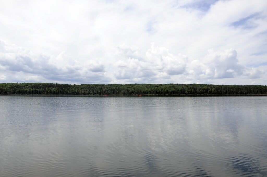 image of distant canoes, Hanging Heart Lakes, Prince Albert National Park, Saskatchewan